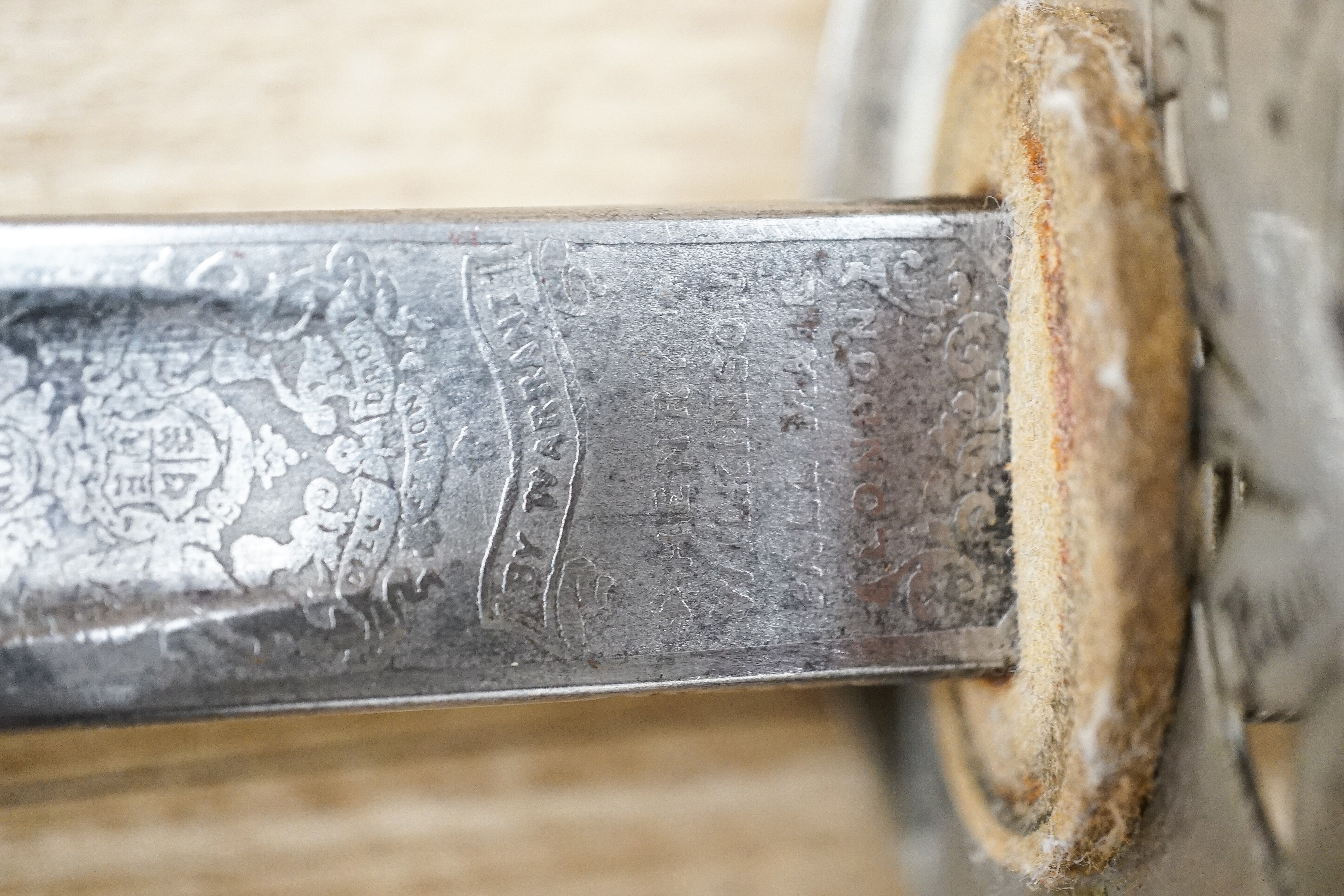 A George V Henry Wilkinson Royal Engineers dress sword with scabbard and cover, the blade etched GHL